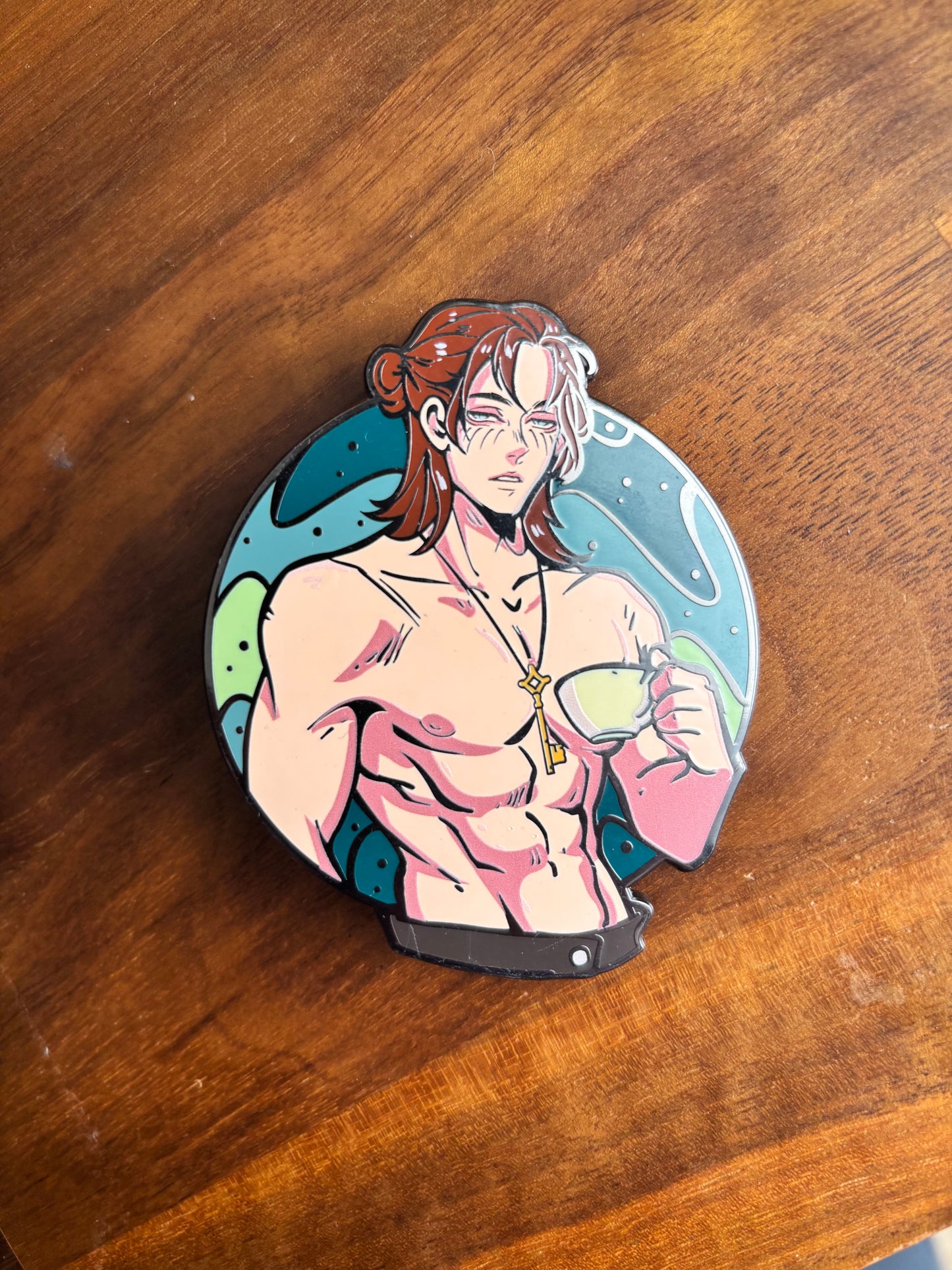 Hard enamel pin of Eren Yeager drinking tea, inspired by Attack on Titan, available in classic, manga, metallic, and glitter variants.