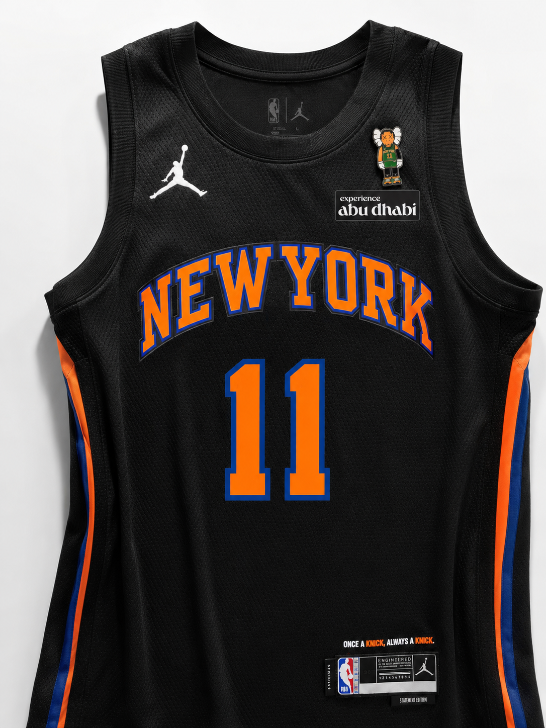 Black basketball jersey with 'New York' and number '11', featuring Jordan Brand logos on a white background.