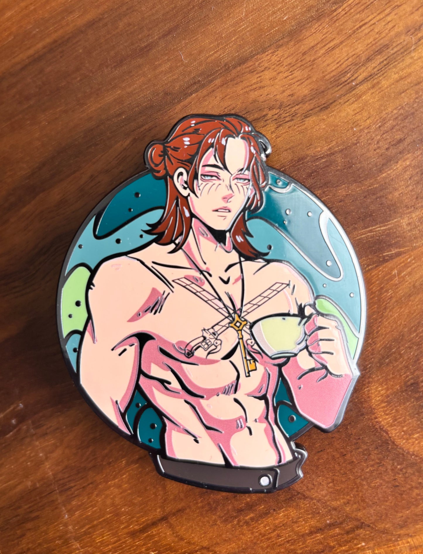 Eren tea-time enamel pin displayed alongside other Attack on Titan anime merch, perfect for collectors.