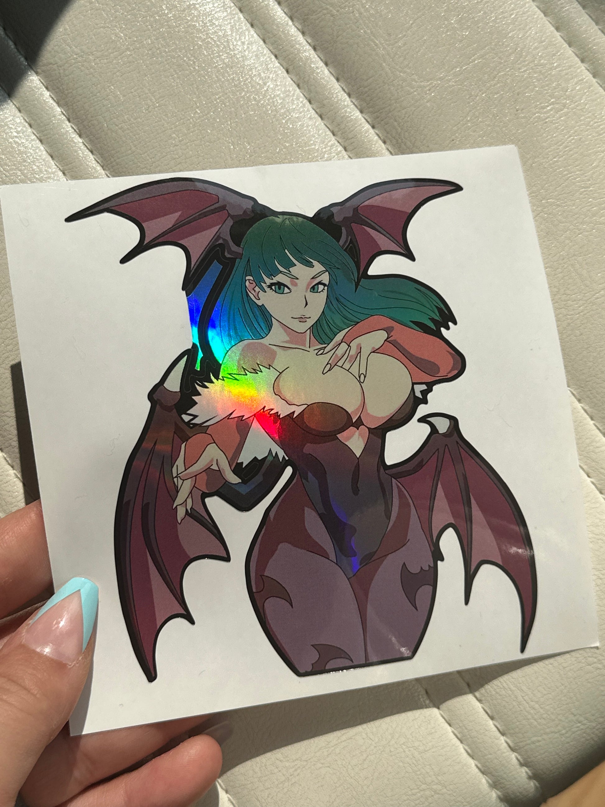 Morrigan Darkstalkers gamer sticker displayed on black iPad cover with goth desk setup